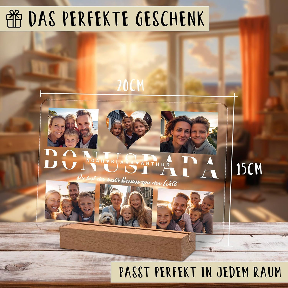 Werbebild einer personalisierten Acryl-Fotoplatte (20 x 15 cm) auf einem Holzständer mit Familienfotos und fettgedrucktem Text „BONUSPAPA“. Das obere Banner lautet „Das perfekte Geschenk“; das untere „Passt perfekt in jedem Raum“.