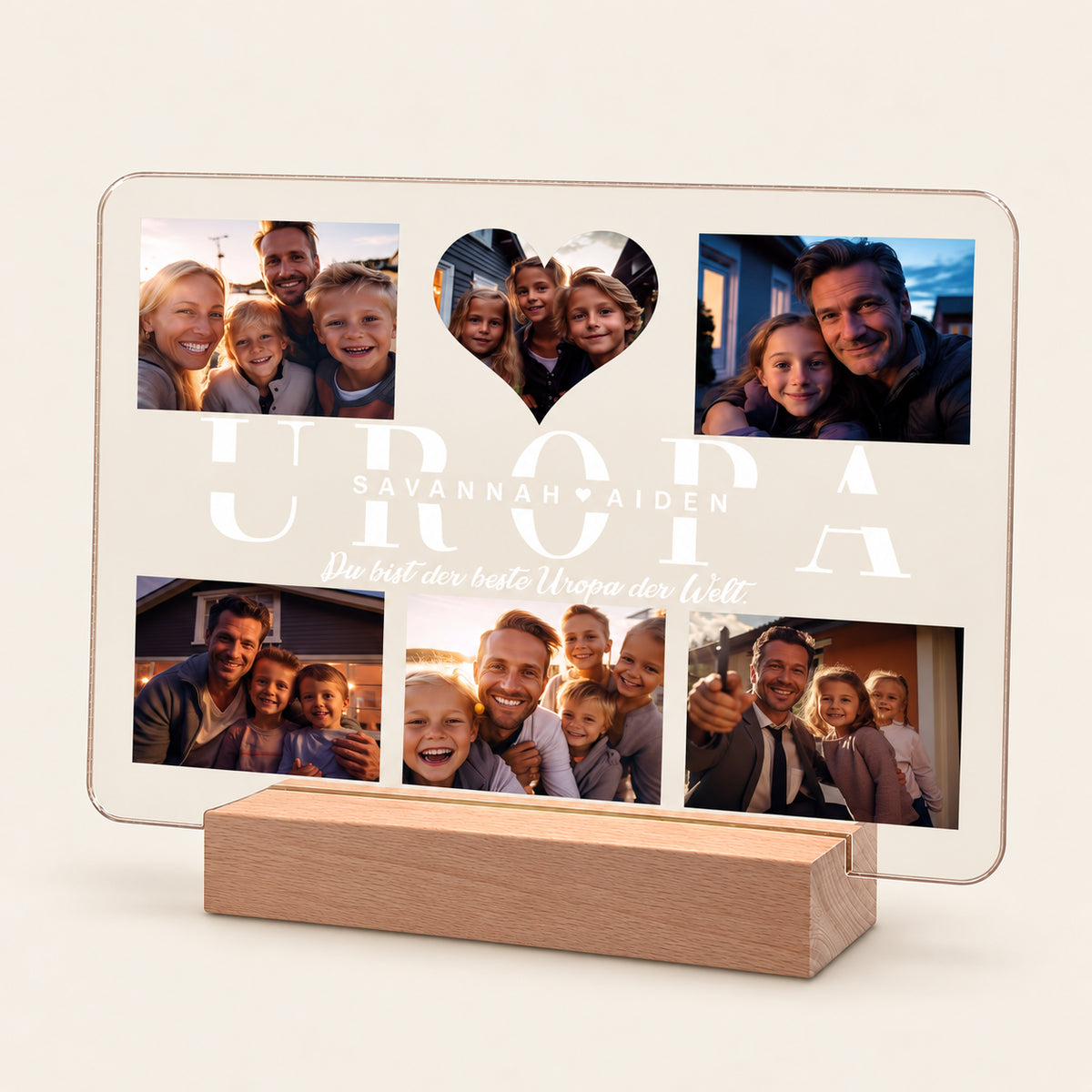 Personalisierte Acryl‑Nachttischlampe auf einem Holz‑LED‑Grund, die eine Familien‑Fotocollage anzeigt. Großer Text lautet 'UROPA' mit 'SAVANNAH AIDEN' und 'Du bist der beste Uropa der Welt.' Ein herzförmiger Ausschnitt hält ein Foto von sechs Familienfotos.