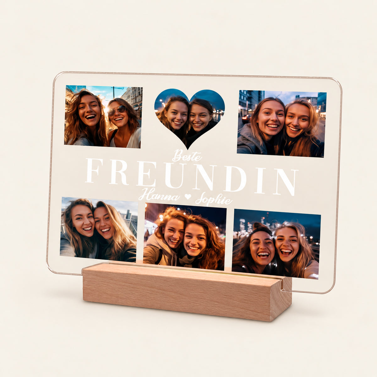 Personalisierte Acryl-Fotodose auf einem Holz‑LED‑Ständer mit 5 Fotos von zwei jungen Frauen, einem herzförmigen Mittelbild und weißem Text 'Beste FREUNDIN Hanna Sophie' samt kleinem Herz.