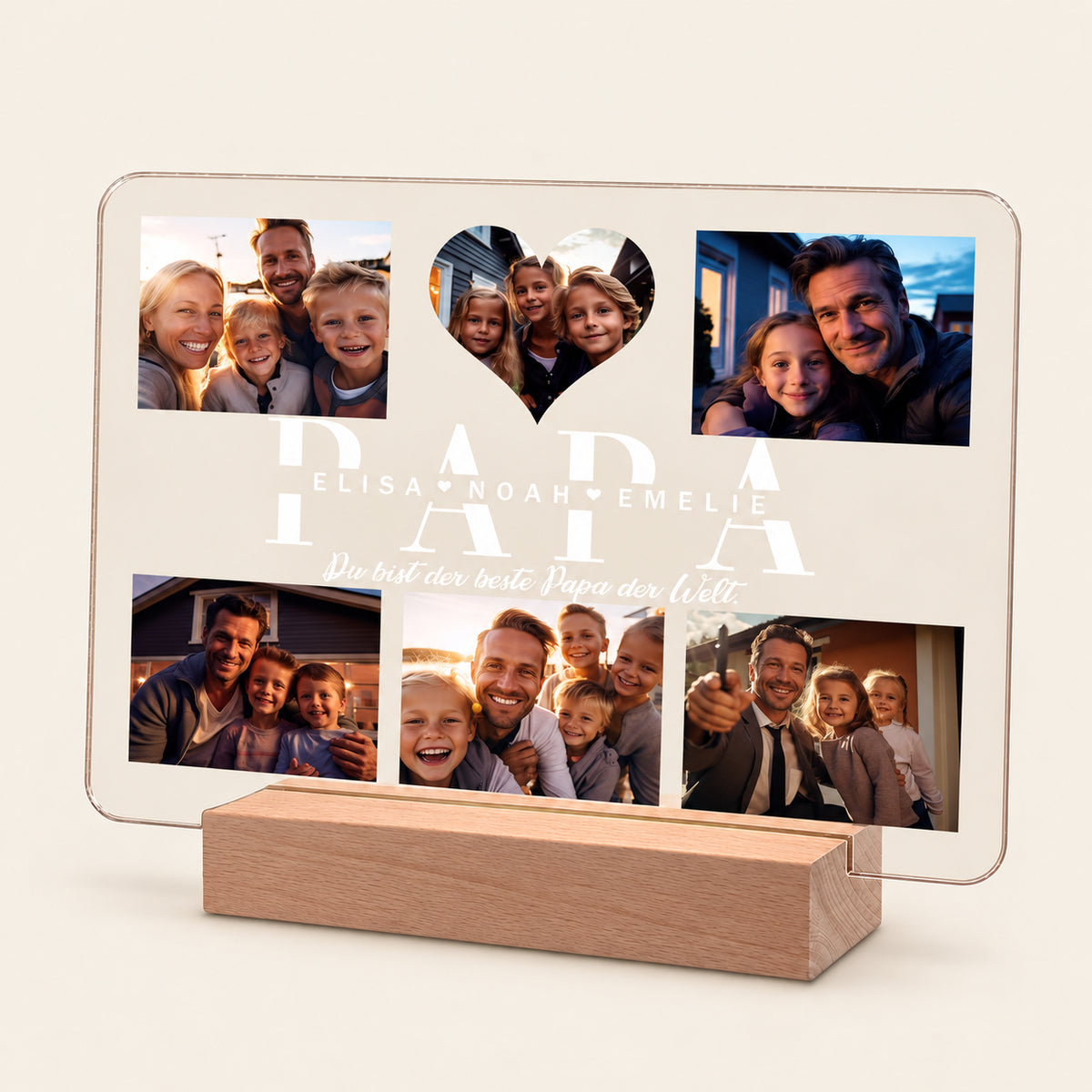 Personalisierte Acryl‑LED‑Nachttischlampe auf Holzständer mit Fotocollage, die „PAPA“ in großen Buchstaben, ein herzförmiges Mittel‑Foto‑Ausschnitt, die Namen „Elisa, Noah, Emelie“ und den deutschen Text „Du bist der beste Papa der Welt“ zeigt.
